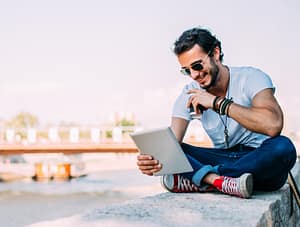 EU Digital Nomad Pass, a way to make the EU more attractive to Digital Nomads 2 hipster reading tablet outdoor